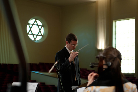Richard Tolbert conducting a string ensemble